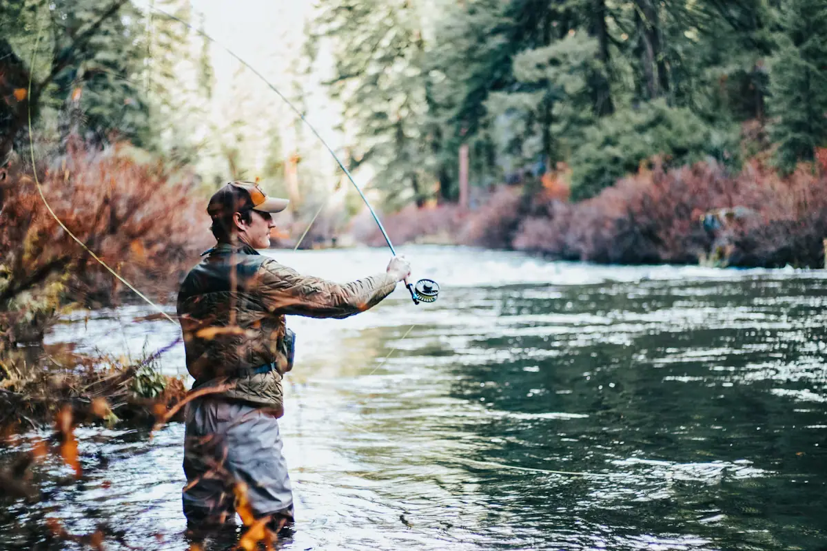 An angler casting a line into open water